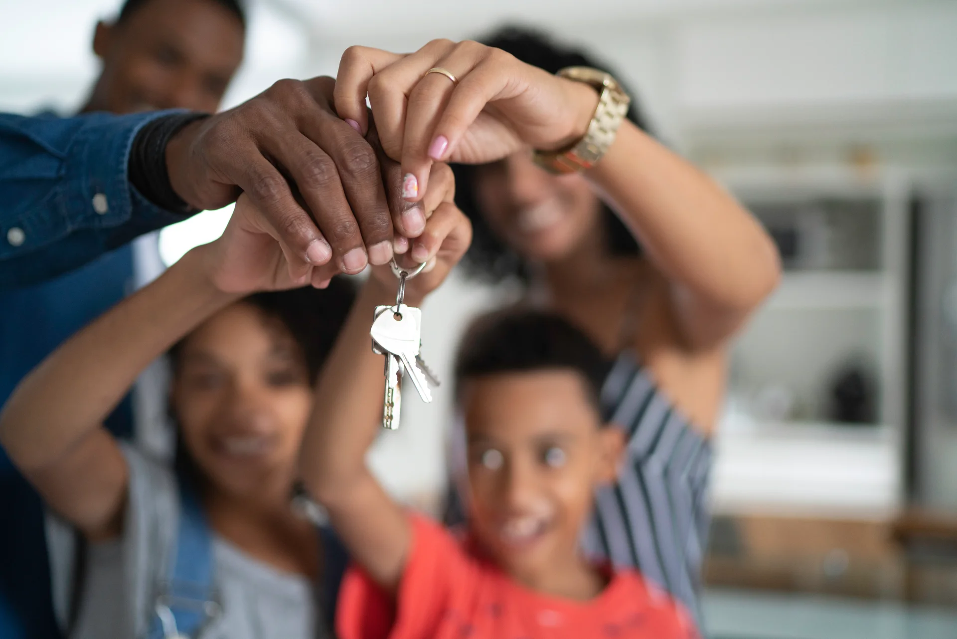 A young family receiving the keys to their first home